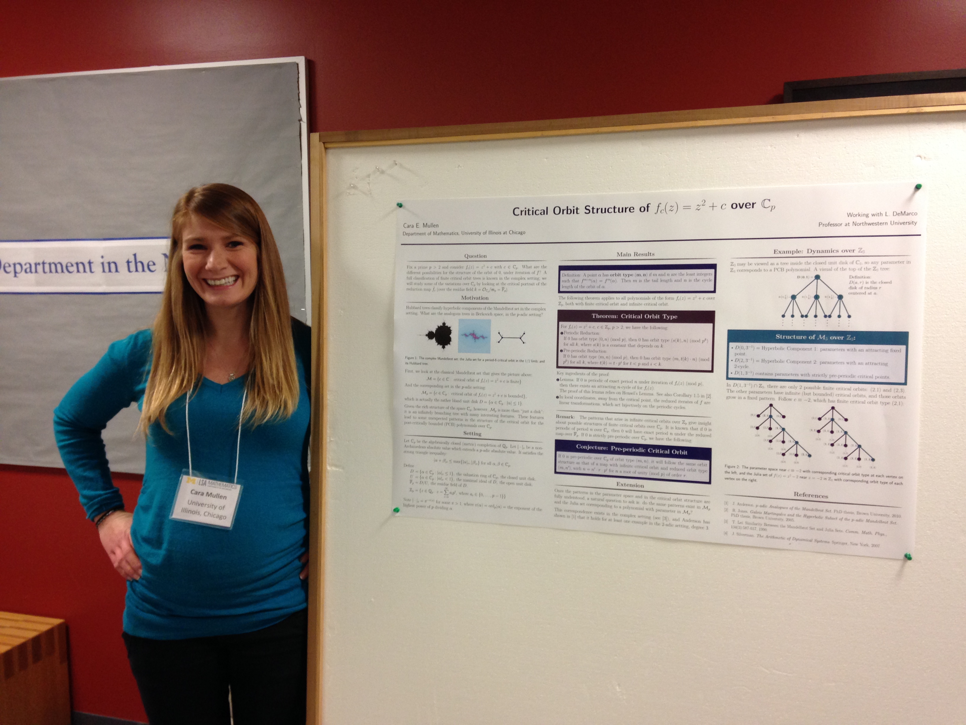 Photo of Cara Mullen presenting a poster at the Midwest Dynamical Systems Meeting in 2014.