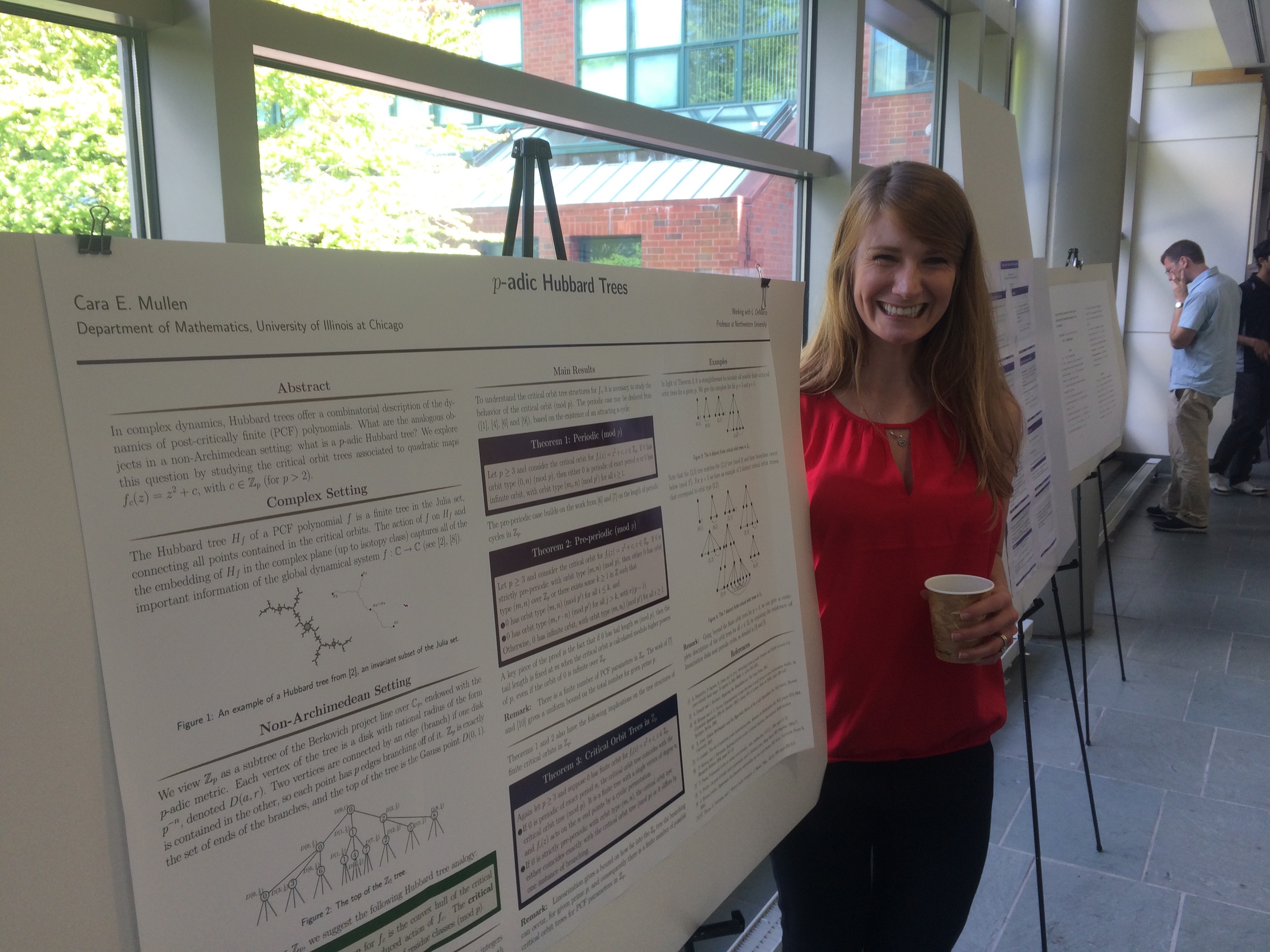 Photo of Cara Mullen presenting a poster at the Silvermania conference in 2015.